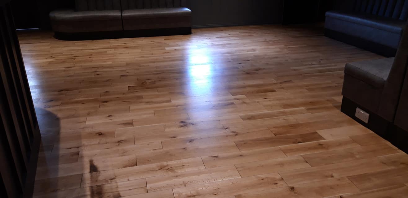 Best1 Floor Sanders professionals sanding a hardwood floor